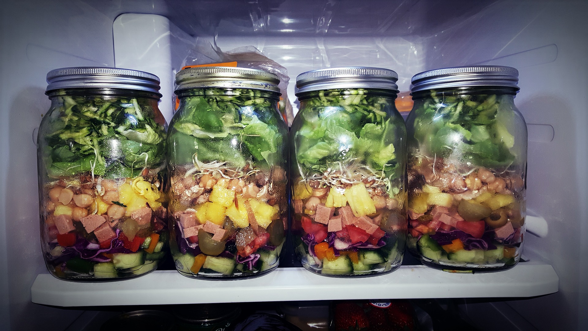 Mason jars filled with salad